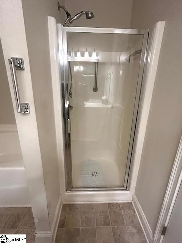 bathroom featuring an enclosed shower