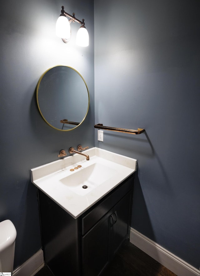 bathroom featuring wood-type flooring and vanity