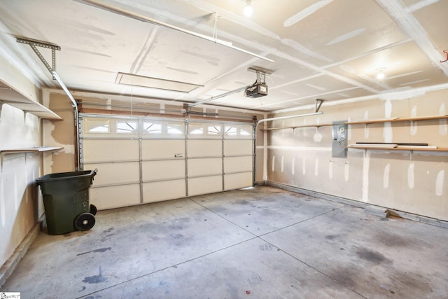 garage with electric panel and a garage door opener