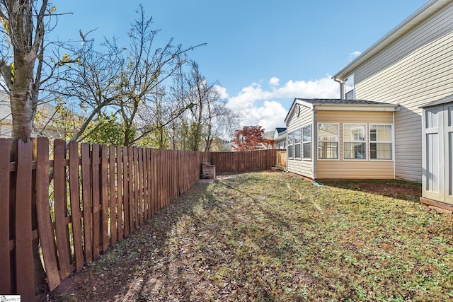 view of yard with a sunroom