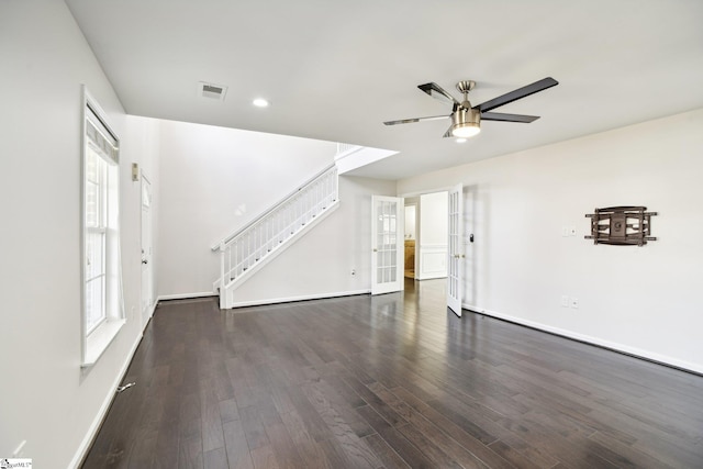 unfurnished living room with dark hardwood / wood-style floors and ceiling fan