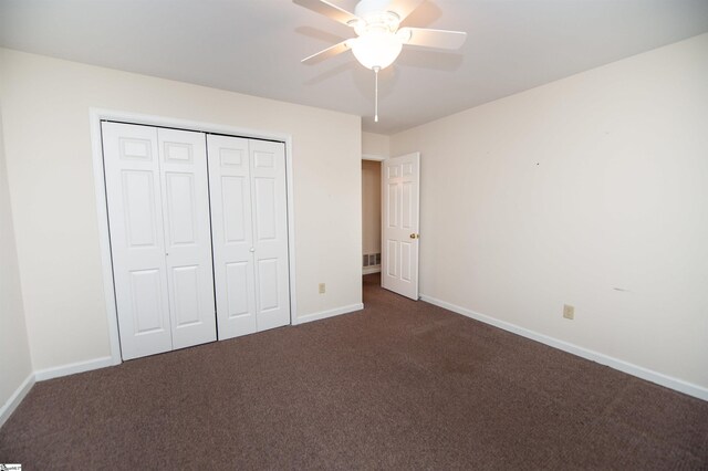 164 Buckstone Ln, Spartanburg, SC 29307 - unfurnished bedroom with dark colored carpet, a closet, and a ceiling fan