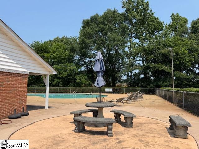 164 Buckstone Ln, Spartanburg, SC 29307 - community pool featuring a patio and view of scattered trees