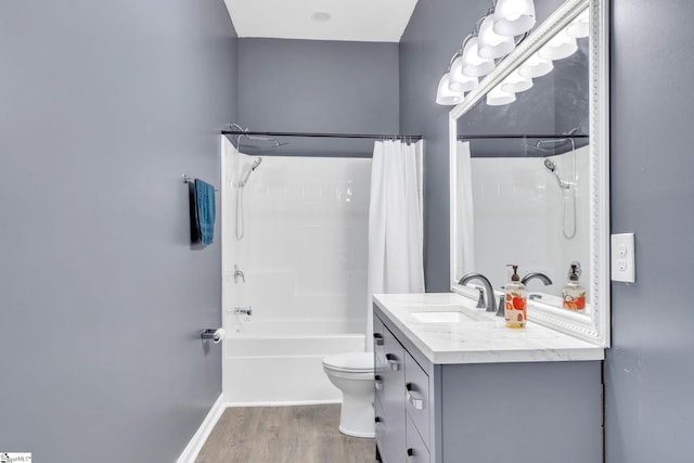 full bathroom featuring hardwood / wood-style floors, vanity, toilet, and shower / bath combination with curtain