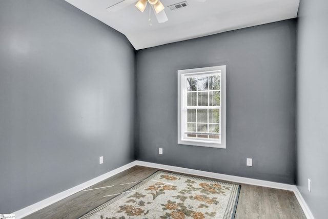 spare room with ceiling fan and wood-type flooring