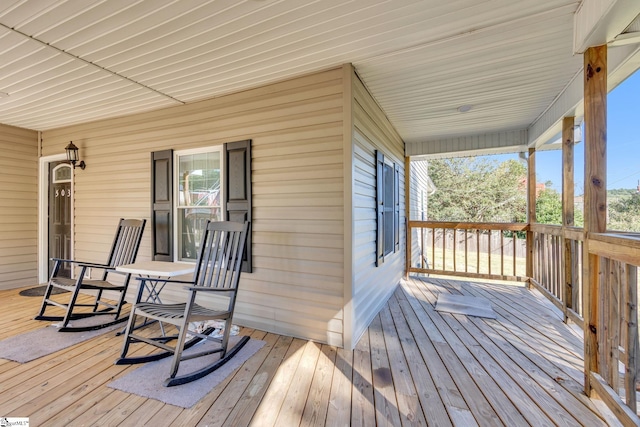 wooden terrace with covered porch