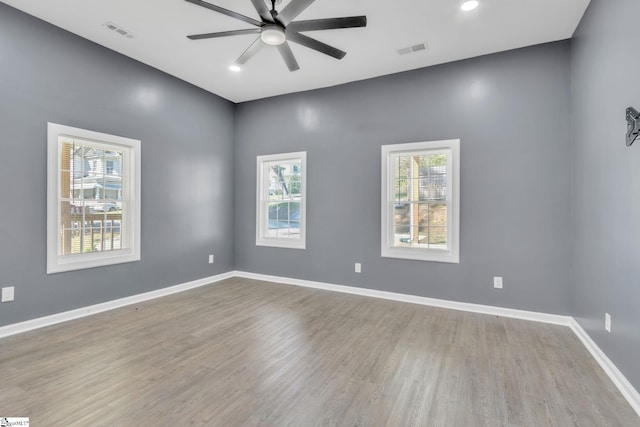 unfurnished room featuring light hardwood / wood-style flooring and ceiling fan