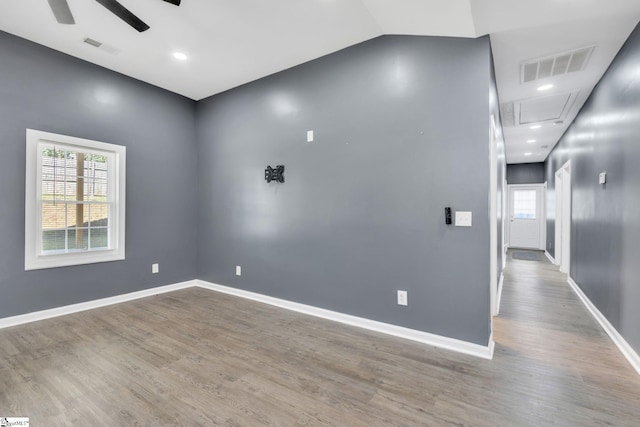 spare room with wood-type flooring and ceiling fan