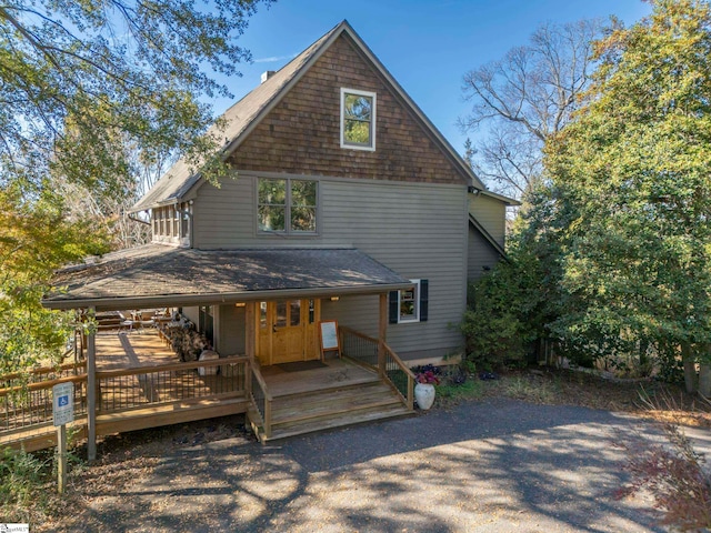 back of property featuring a porch