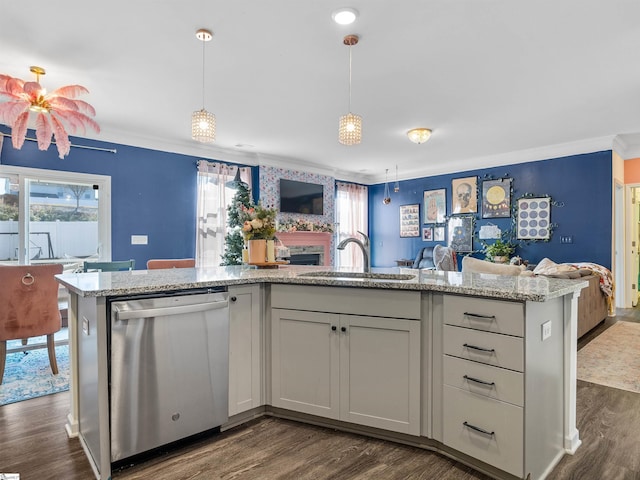 kitchen featuring crown molding, sink, stainless steel dishwasher, dark hardwood / wood-style floors, and light stone countertops