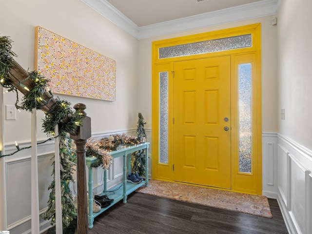 foyer entrance featuring crown molding and dark wood-type flooring