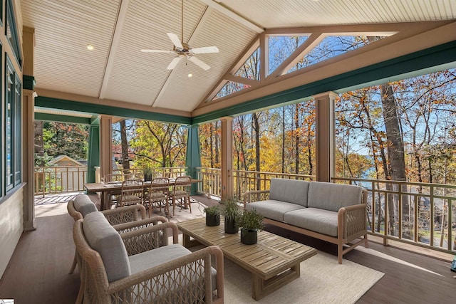 sunroom / solarium with ceiling fan and lofted ceiling