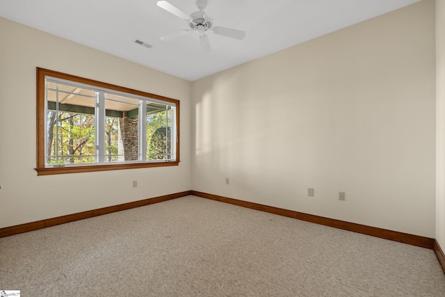 carpeted empty room with ceiling fan