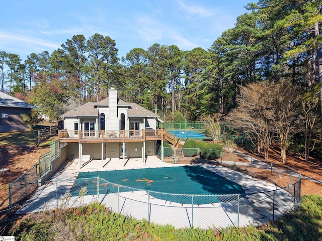 view of swimming pool featuring a patio area and a deck