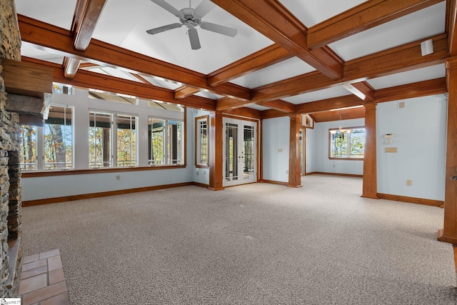 unfurnished living room with beam ceiling, ceiling fan, light colored carpet, and coffered ceiling