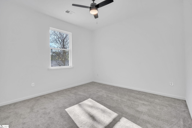 unfurnished room featuring light carpet and ceiling fan