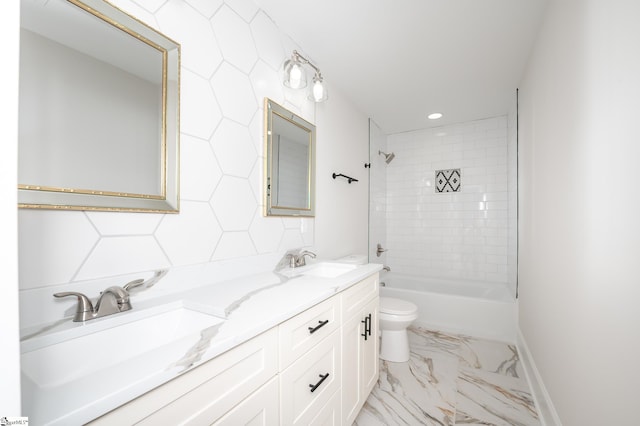 full bathroom featuring tiled shower / bath combo, toilet, and vanity