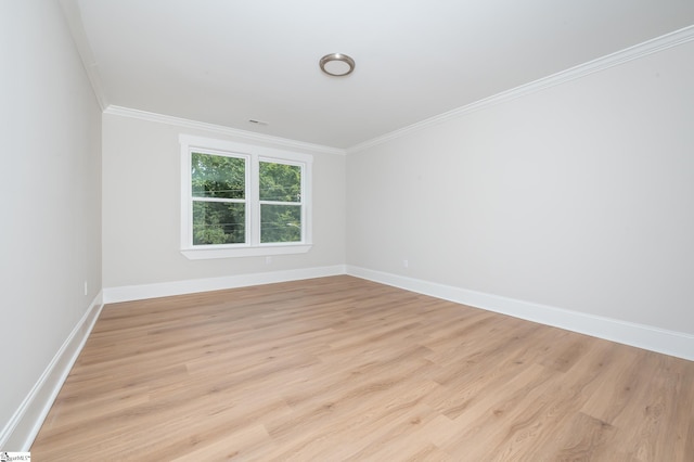 unfurnished room with light hardwood / wood-style floors and ornamental molding