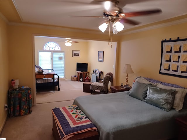 bedroom with ceiling fan, carpet, and ornamental molding