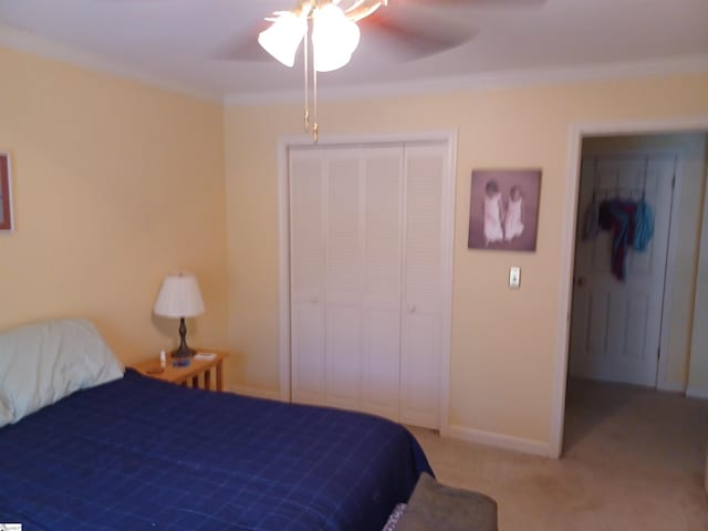 bedroom featuring ceiling fan, crown molding, and light carpet