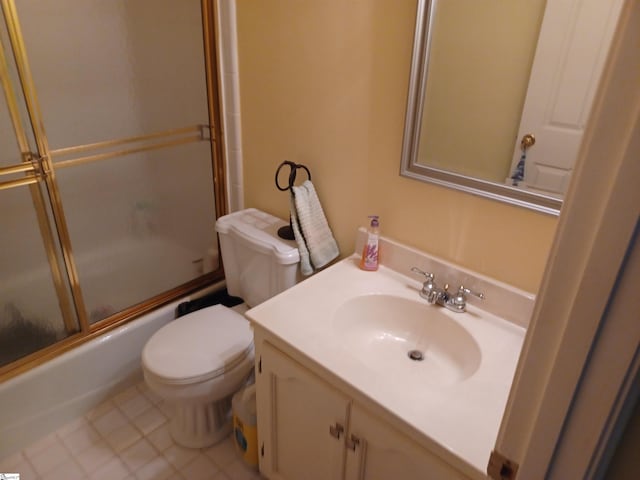 full bathroom with combined bath / shower with glass door, toilet, and vanity