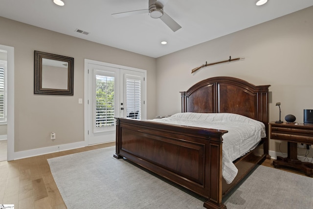 bedroom with access to exterior, french doors, light hardwood / wood-style flooring, and ceiling fan