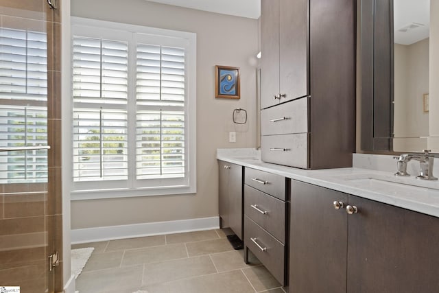 bathroom with tile patterned floors and vanity