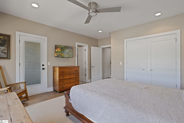 bedroom with light hardwood / wood-style floors and ceiling fan