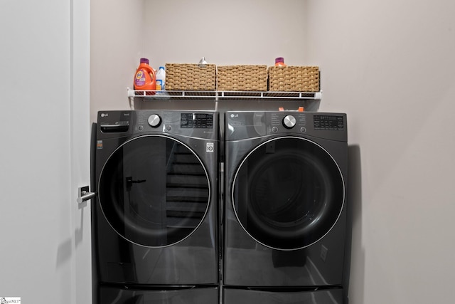 laundry room featuring independent washer and dryer