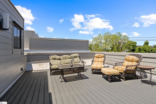 wooden deck with an outdoor hangout area