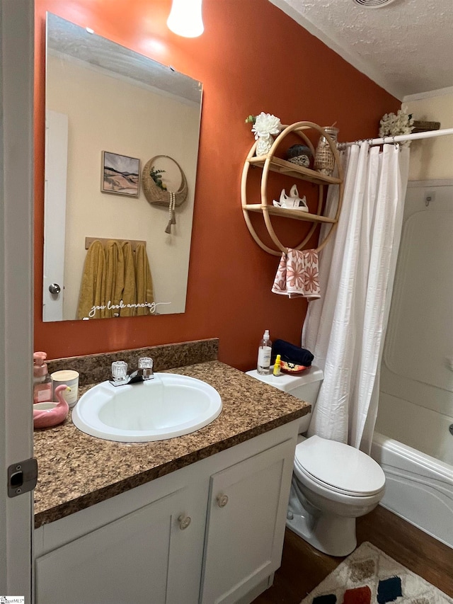 full bathroom with shower / bathtub combination with curtain, a textured ceiling, toilet, vanity, and hardwood / wood-style flooring