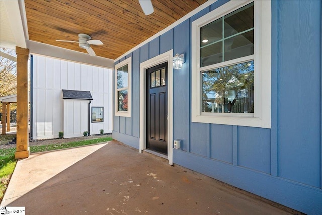 view of exterior entry with ceiling fan