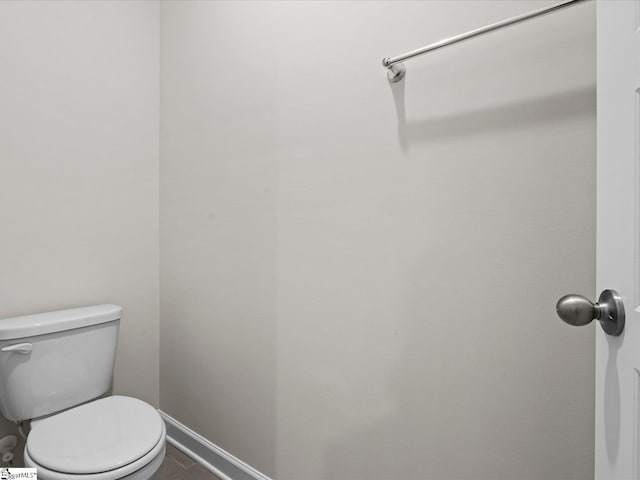 bathroom with tile patterned floors and toilet