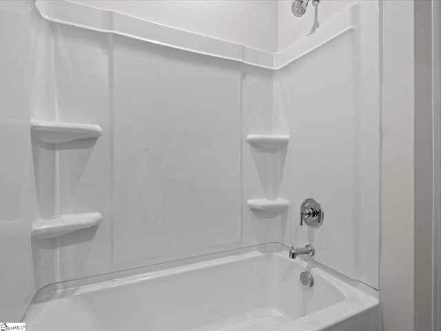 bathroom with shower / washtub combination