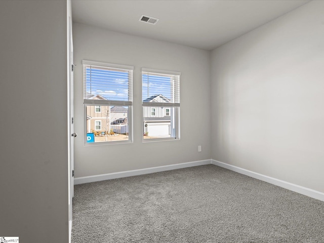 spare room featuring carpet flooring