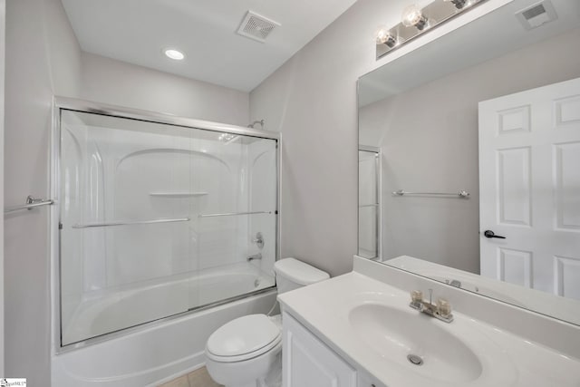 full bathroom featuring vanity, toilet, and enclosed tub / shower combo