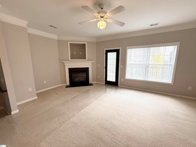 unfurnished living room with ceiling fan, light colored carpet, and ornamental molding