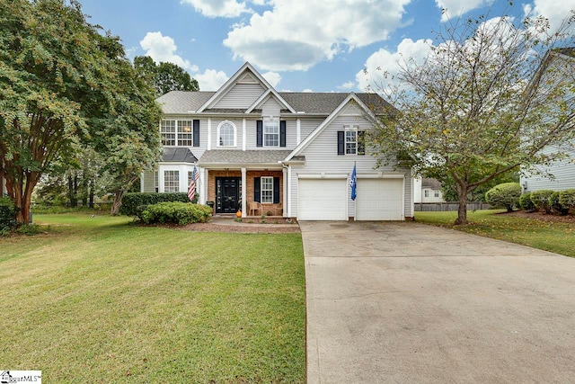 view of front of home with a front lawn, a porch, and a garage