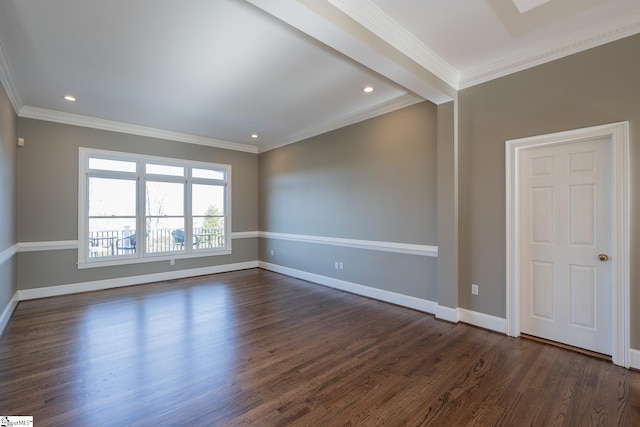 spare room with ornamental molding and dark wood-type flooring