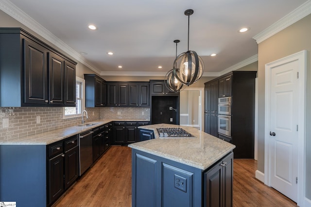 kitchen with sink, a kitchen island, stainless steel appliances, and dark hardwood / wood-style floors