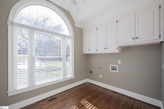 laundry room featuring washer hookup, electric dryer hookup, dark hardwood / wood-style floors, and cabinets