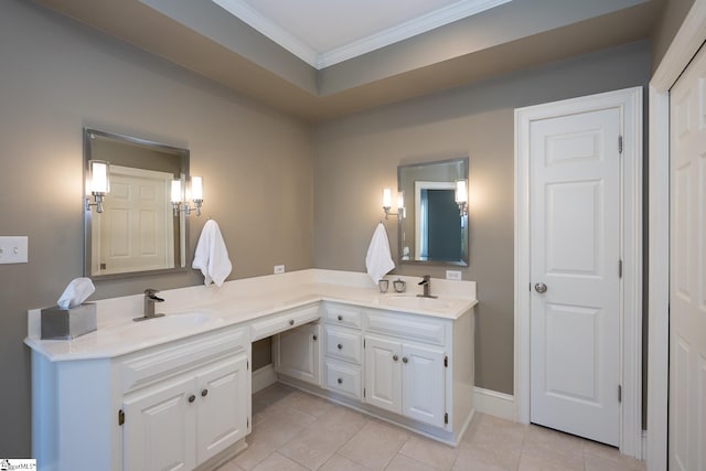 bathroom featuring tile patterned flooring, vanity, and crown molding