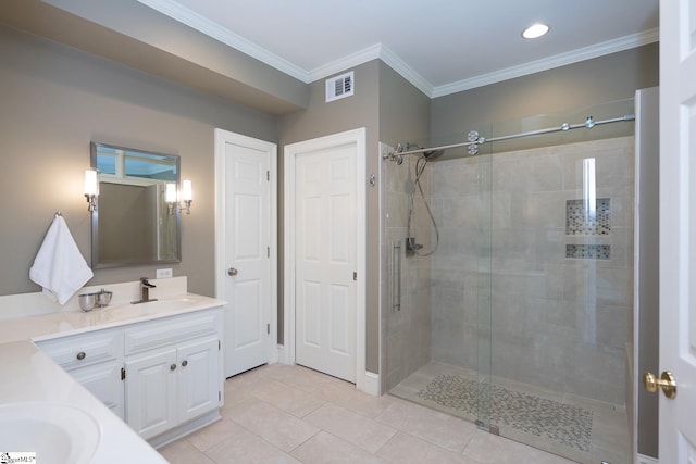 bathroom with tile patterned floors, vanity, a shower with door, and ornamental molding