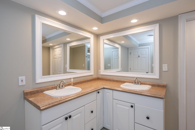 bathroom with vanity and ornamental molding