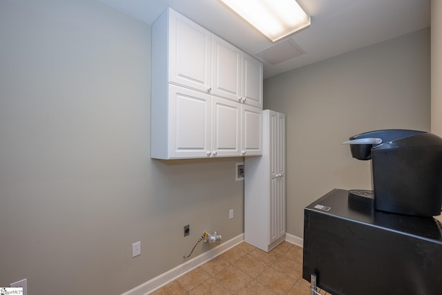 laundry area with cabinets, hookup for a washing machine, hookup for a gas dryer, and hookup for an electric dryer