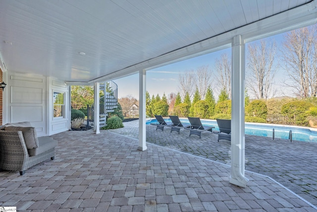 view of patio / terrace with a fenced in pool