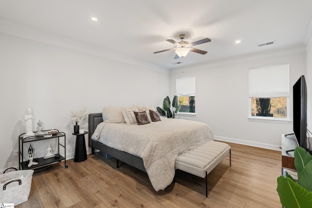 bedroom with ceiling fan, light hardwood / wood-style flooring, and ornamental molding