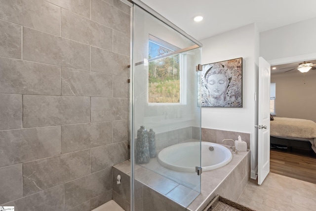 bathroom featuring tile patterned floors, ceiling fan, and shower with separate bathtub