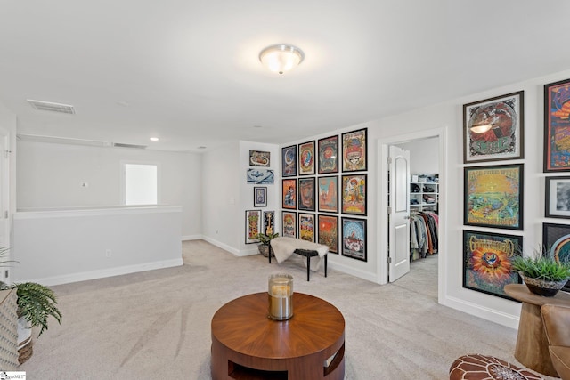 living area featuring light colored carpet