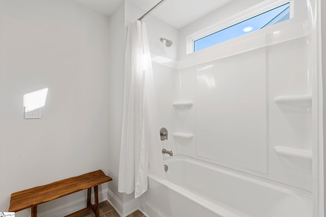 bathroom featuring tile patterned flooring and shower / bath combo